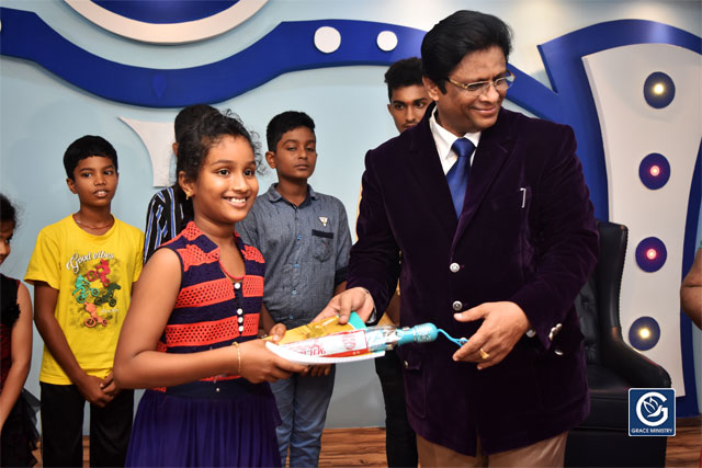 About Ten Poor and needy Students from Various Schools and Colleges of Mangalore brightened up as they received books, umbrellas and Education Scholarship from Grace Ministry on Sunday, June 16th, 2019. 